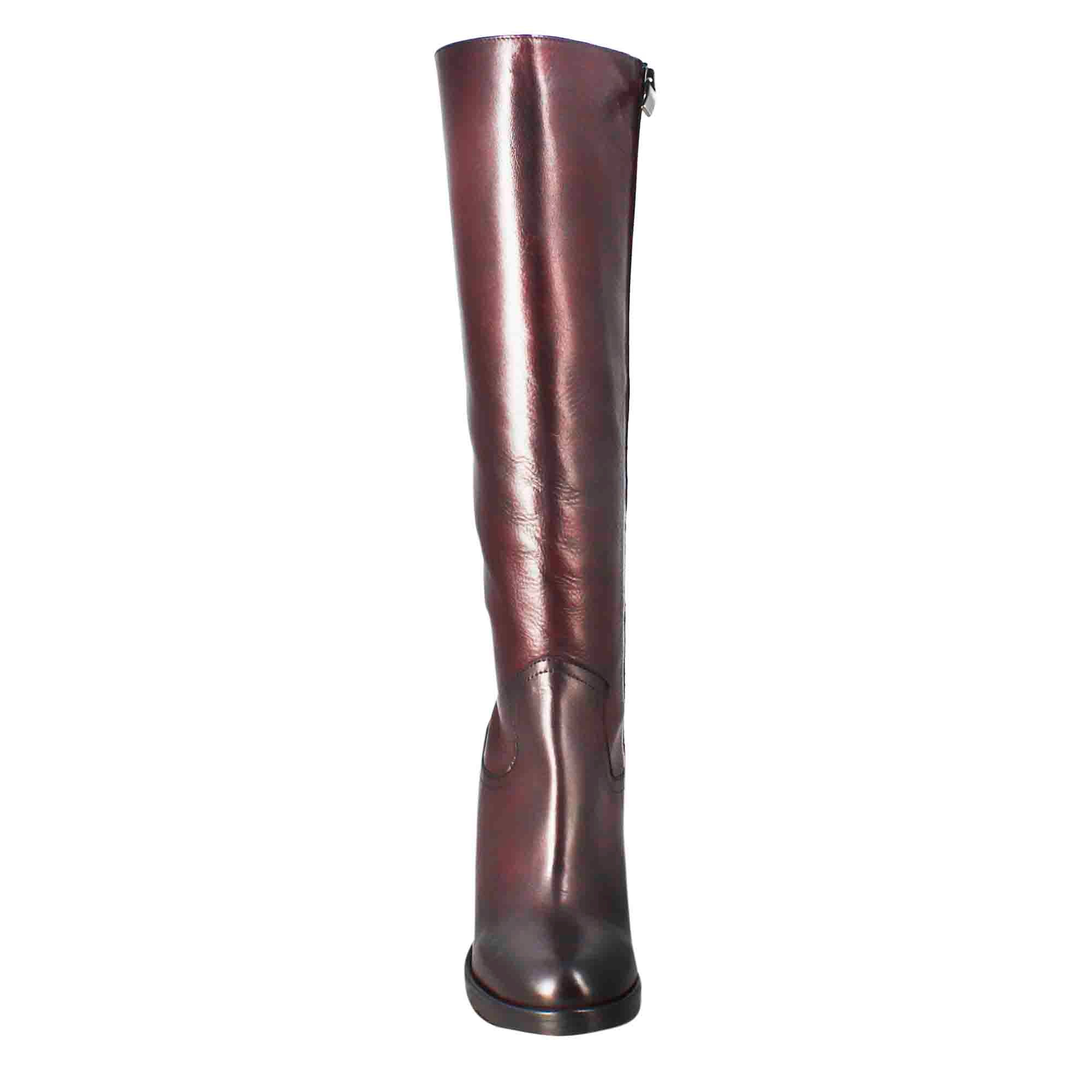 Smooth women's knee-high boot with high heel in burgundy leather